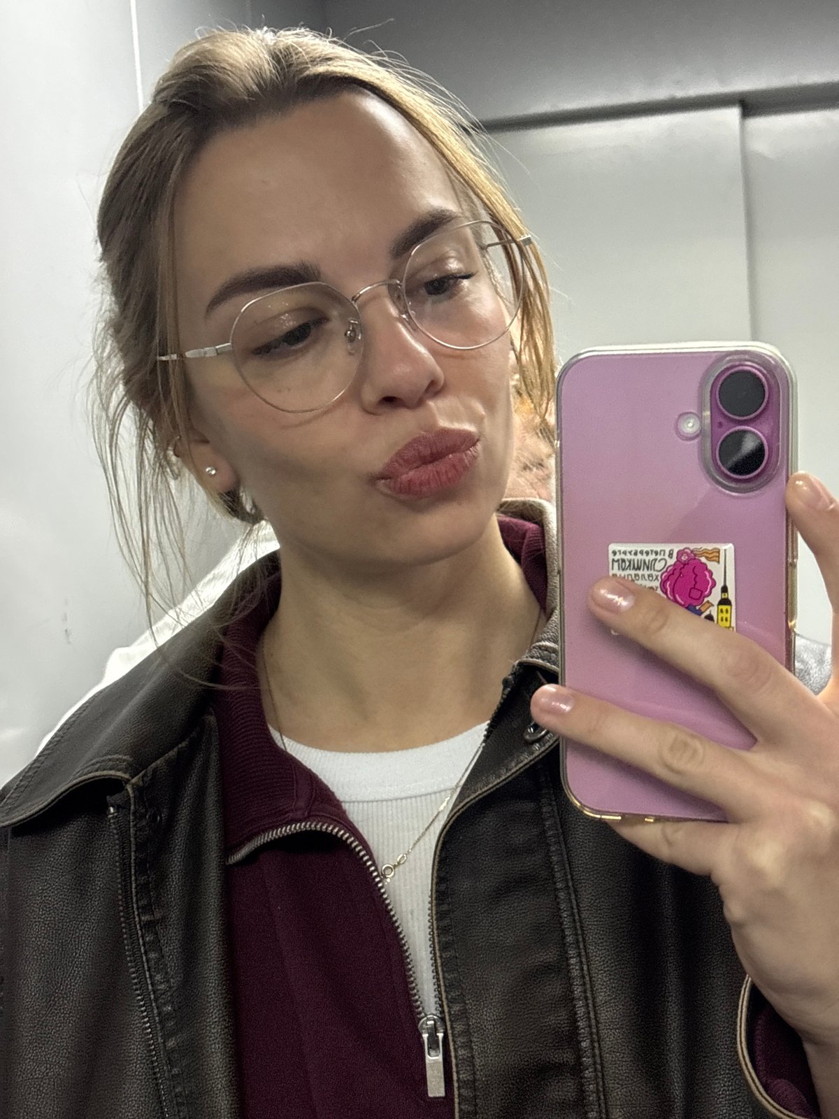 Woman takes selfie with decorated phone in Krasnoyarsk