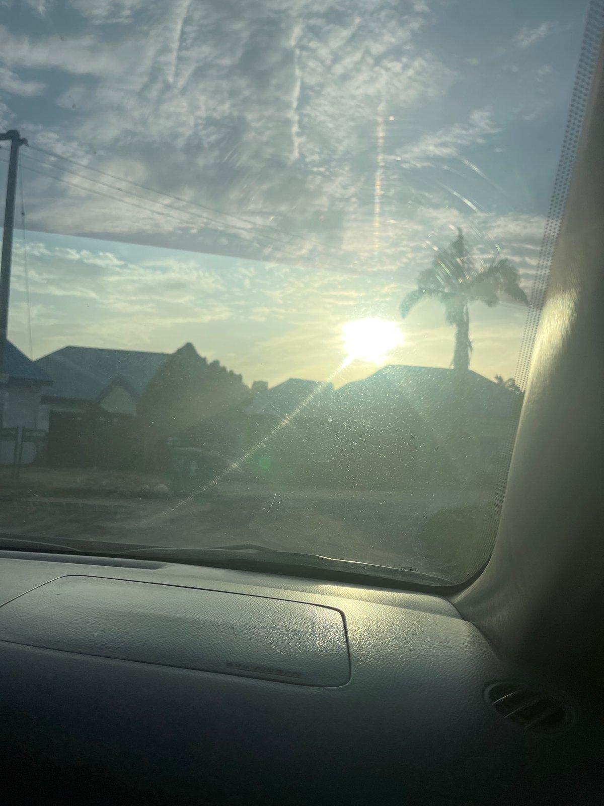 Woman takes sunset selfies on Abuja street