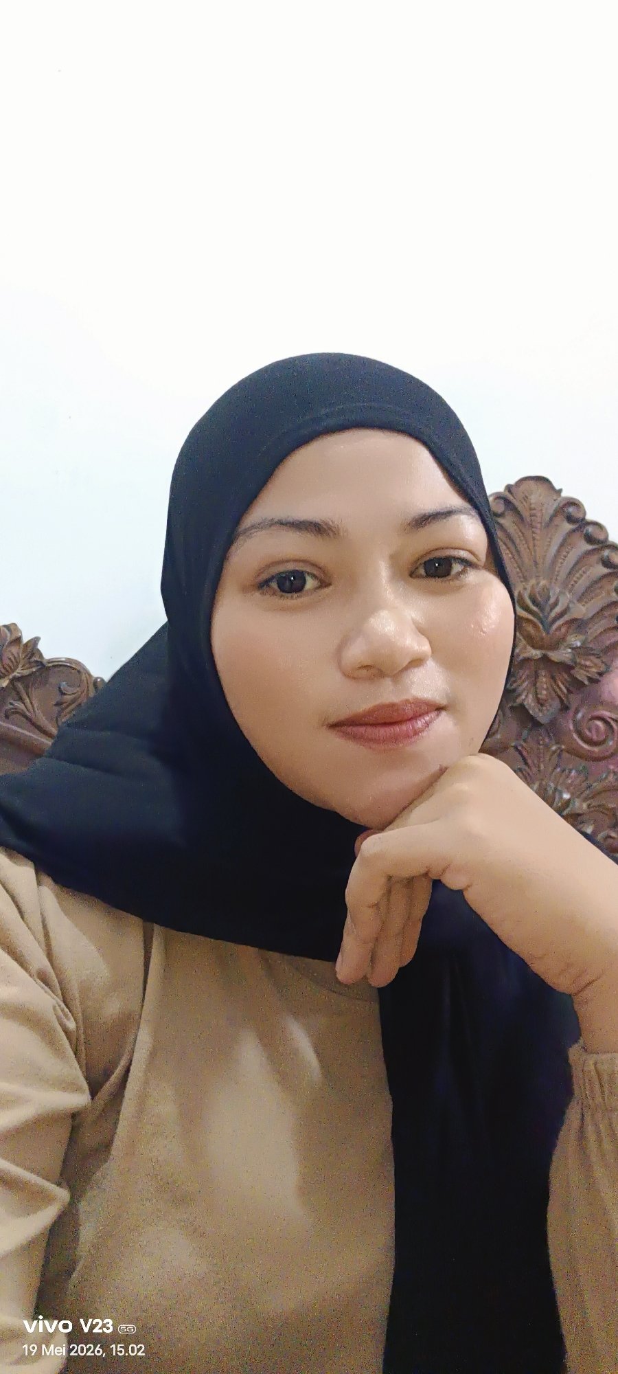 Woman photographed in indoor and outdoor poses in Lhokseumawe
