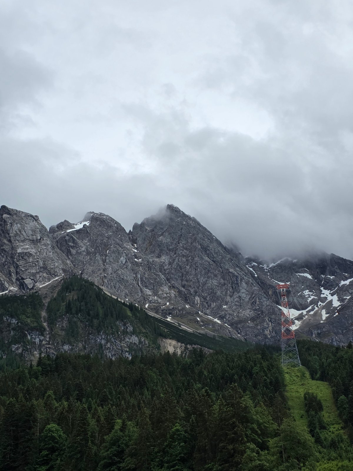 Tourist documents Zugspitze cable car area in overcast conditions