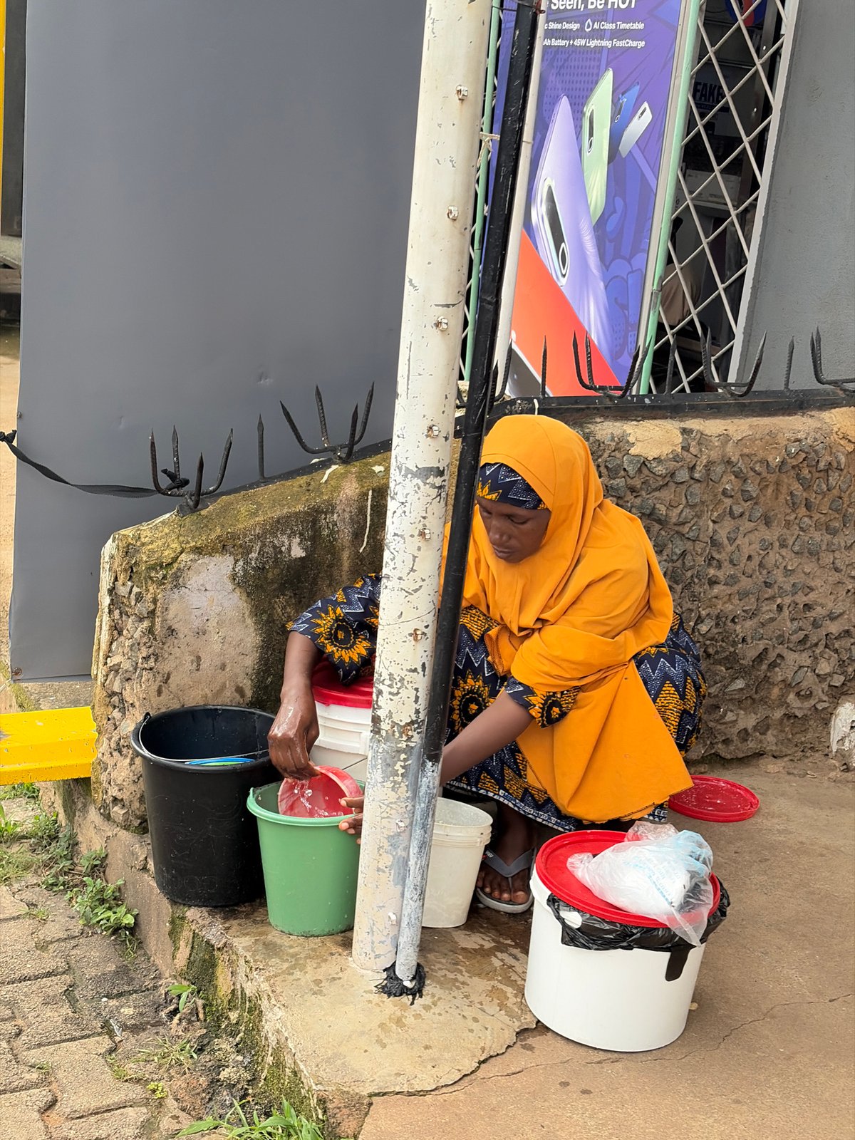 Everyday life on the wet streets of Jos, Nigeria