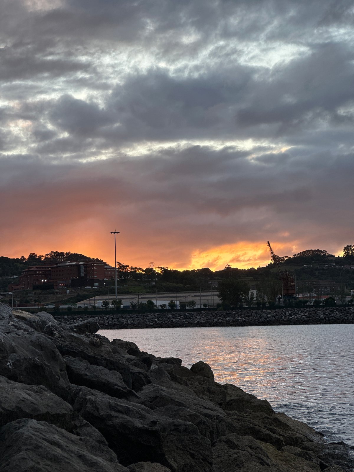 Sunset captured at Gijón harbor waterfront, Spain