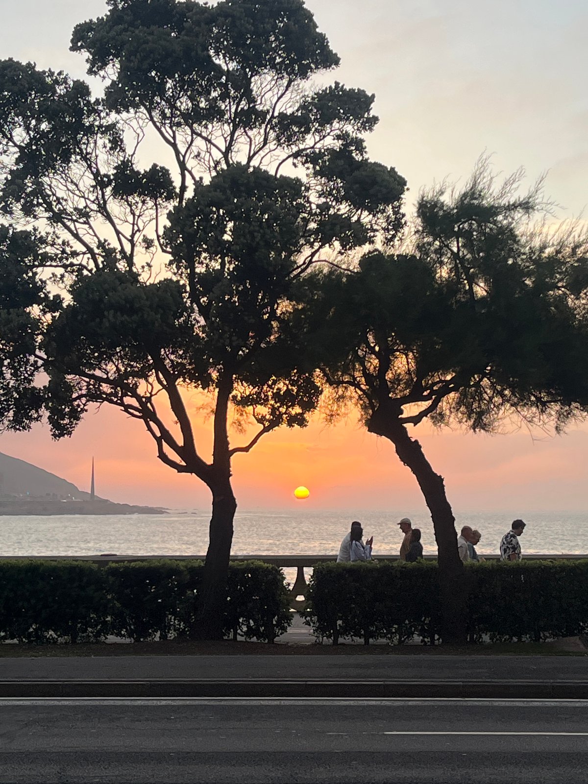 Evening stroll through A Coruña captures sunset, streets, transit