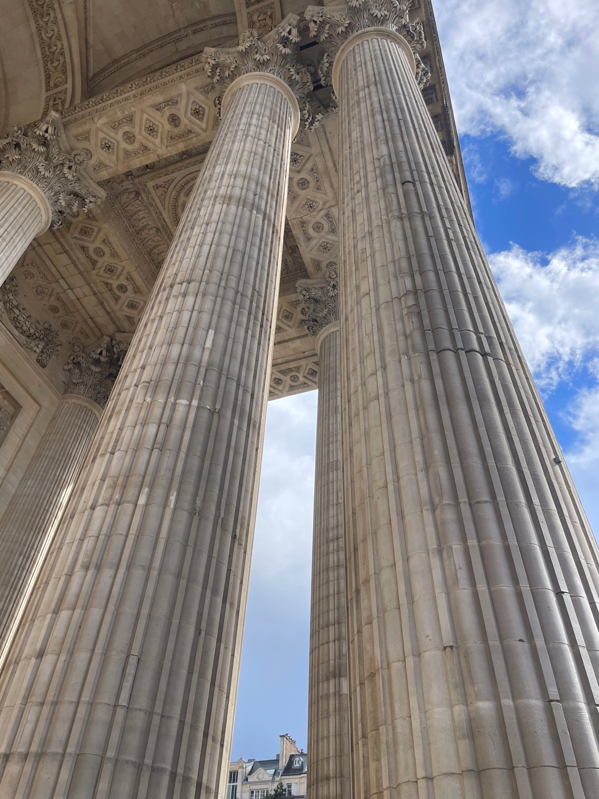 Tourist captures Paris landmarks during afternoon stroll