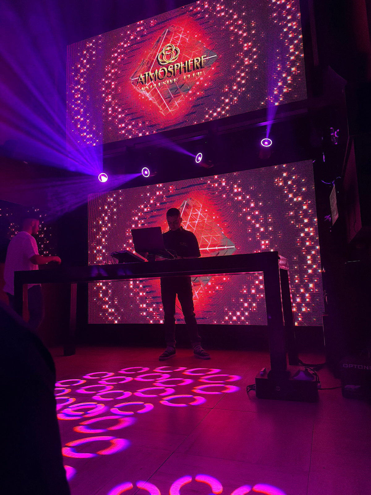DJ performs at Atmosphere nightclub with digital displays