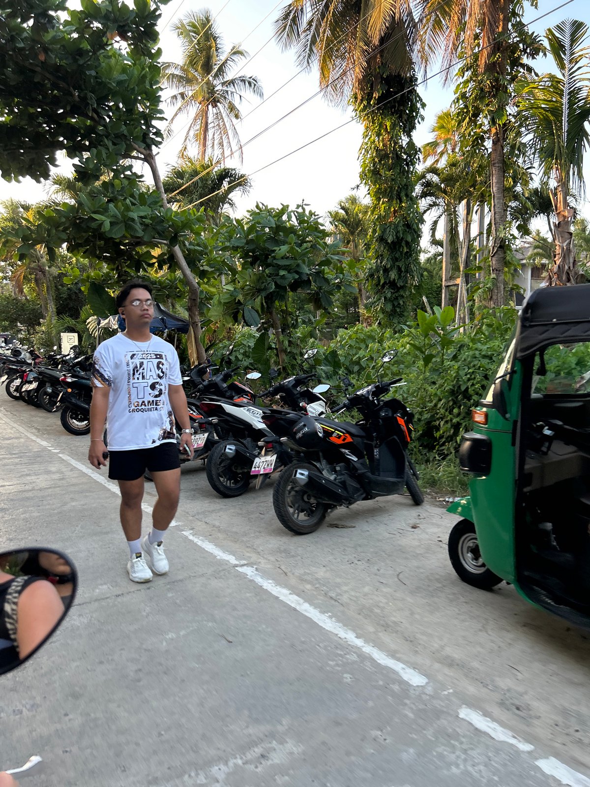 Daily life scene captured near motorcycles and store in General Luna