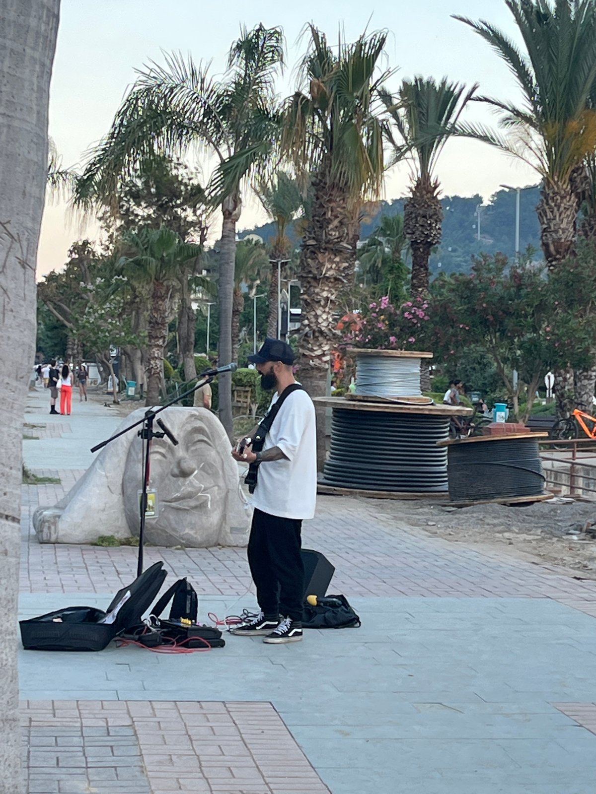 Street musician performs at sunset in Alanya, Turkey