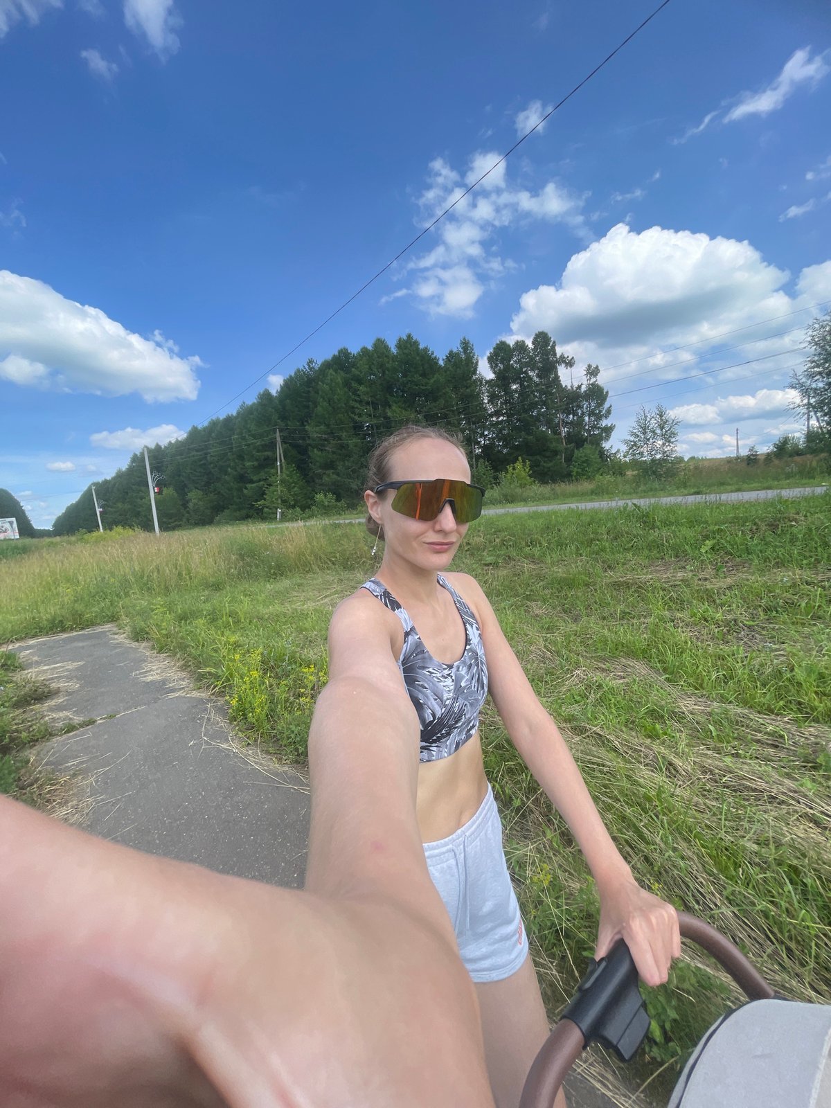 Stroller walk along a paved path in Podshivalovo