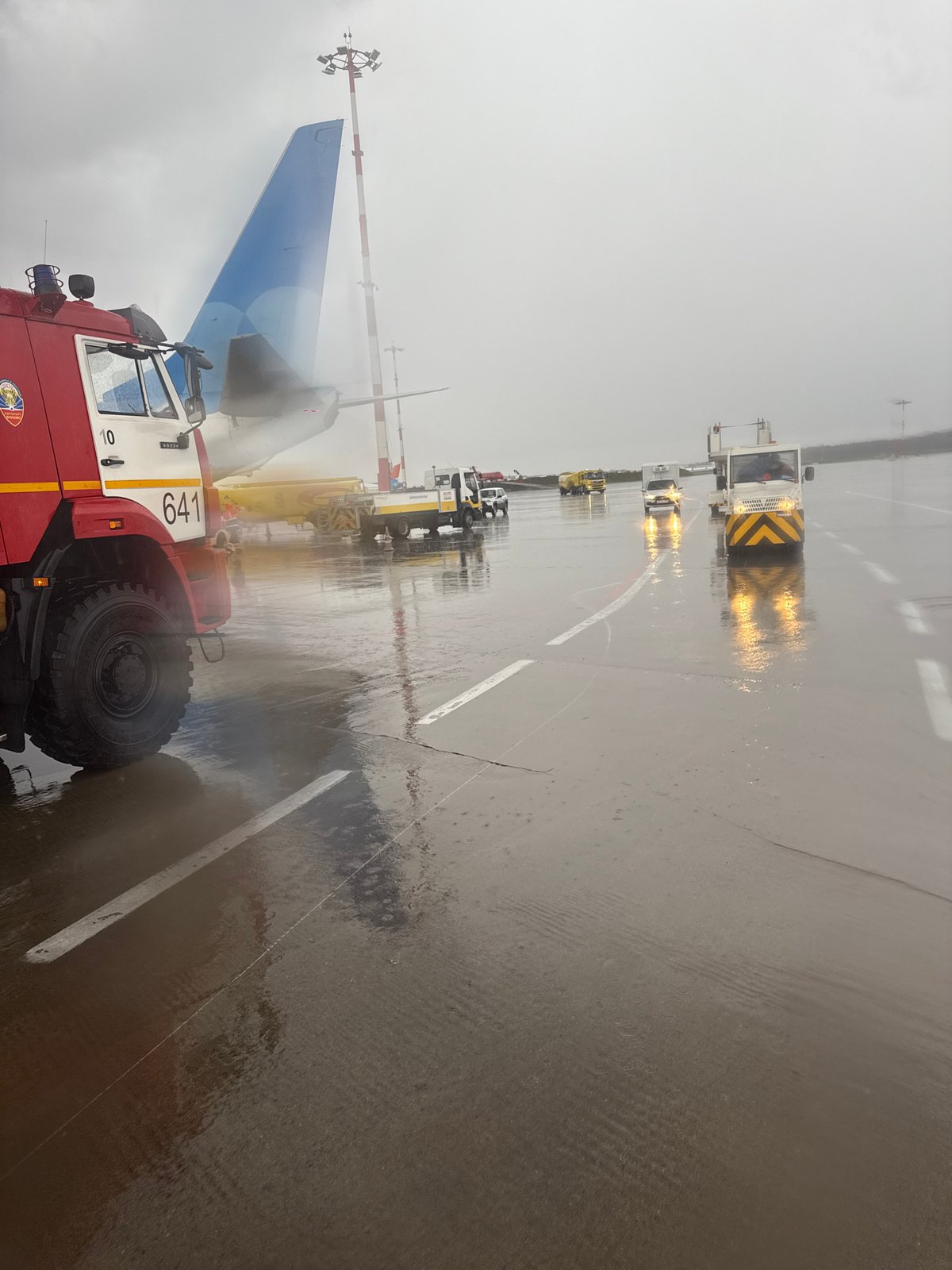 Aircraft receives de-icing treatment at Vnukovo Airport during wet weather