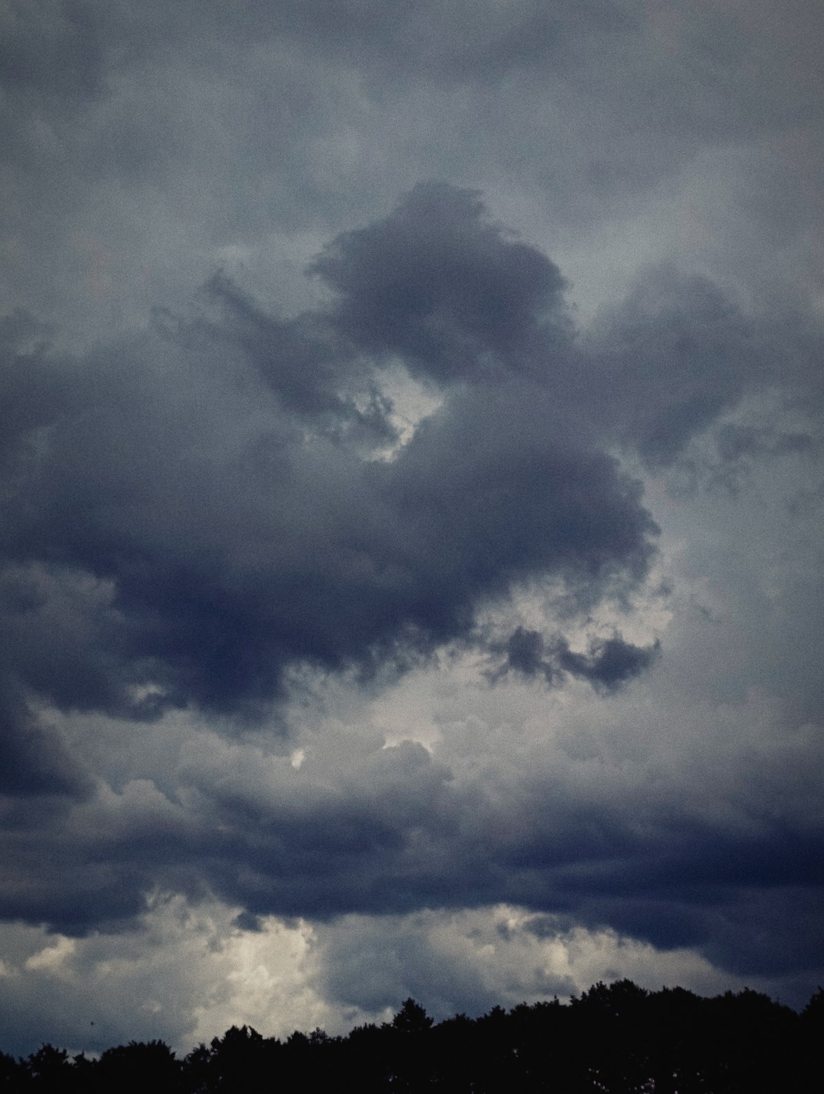 Storm clouds gather over Minsk neighborhoods on a July morning