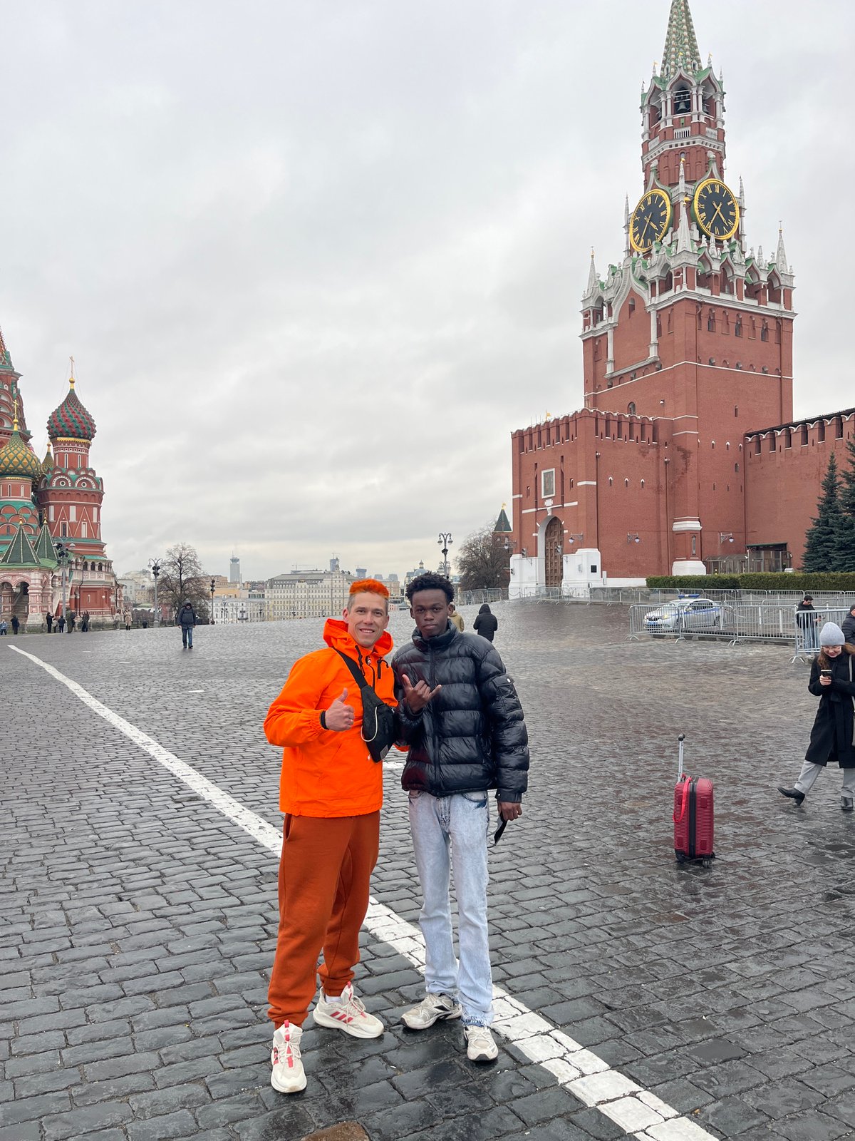Young men pose on Moscow pedestrian crossing