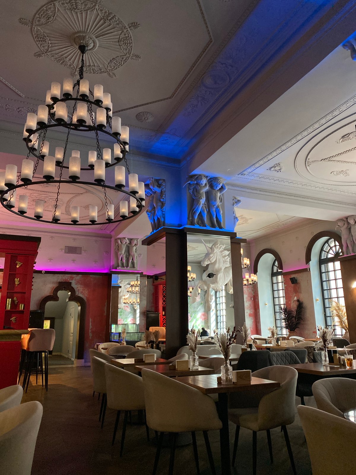 Ornate restaurant interior with classical architecture documented by witness