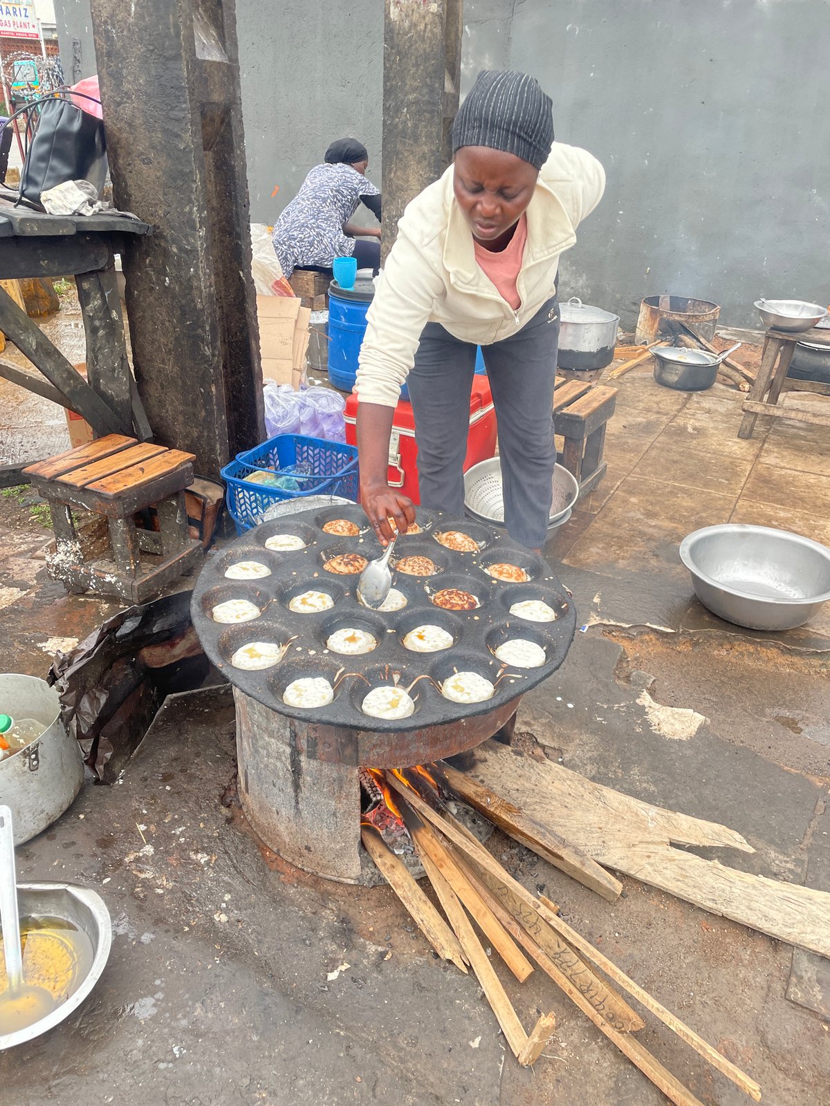 Rainy morning street life and food vendors in Jos, Nigeria