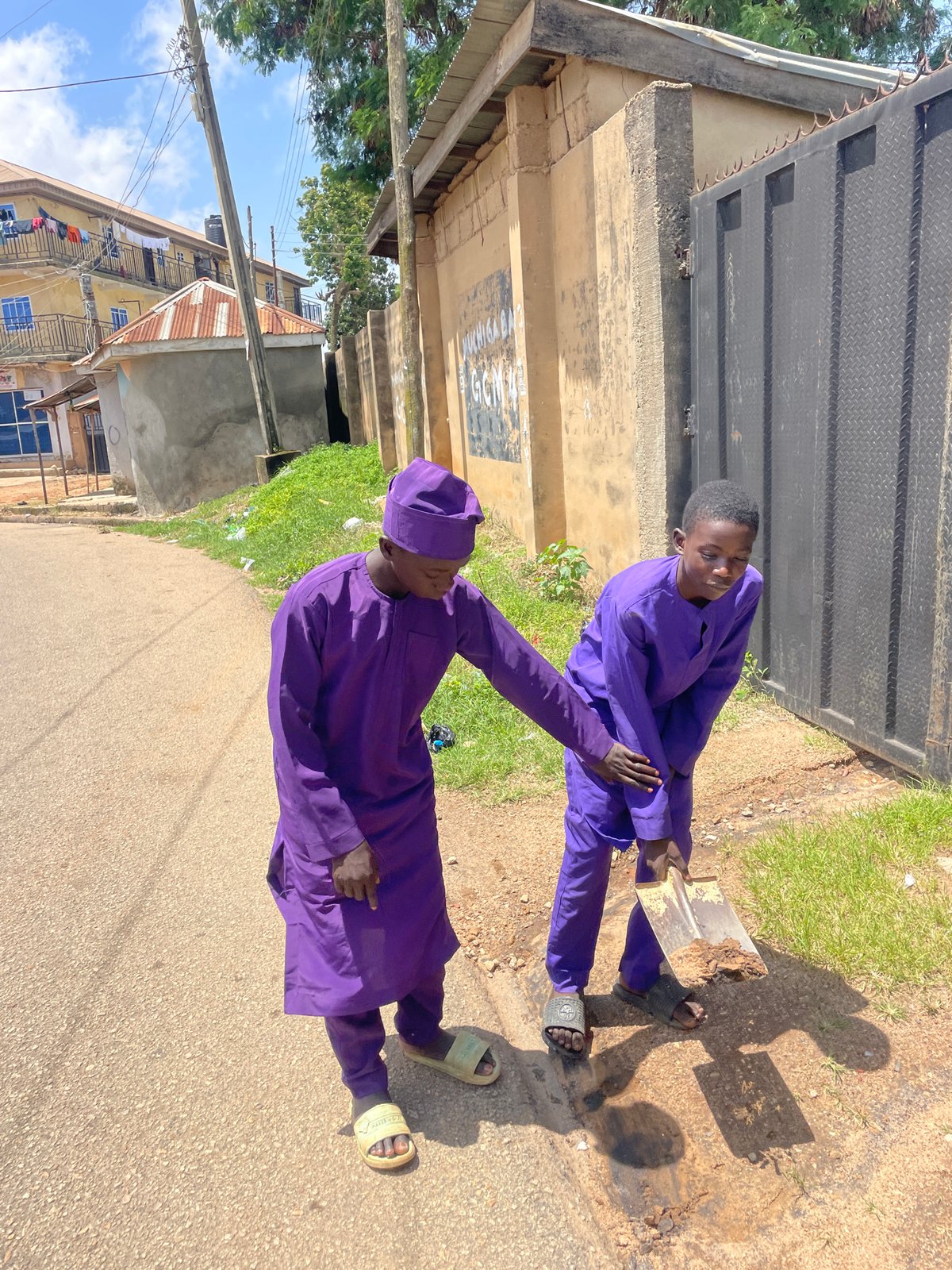 Everyday life across a Jos neighborhood on a Sunday morning