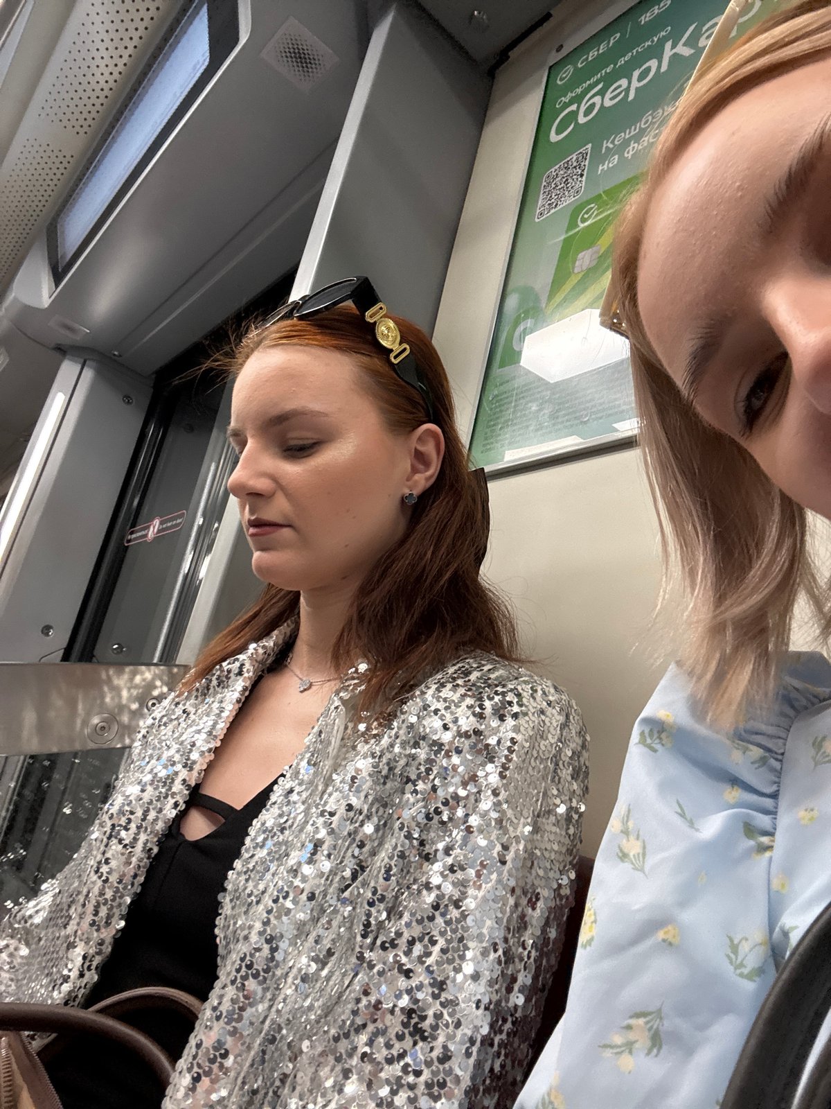 Young women ride Saint Petersburg Metro during afternoon commute