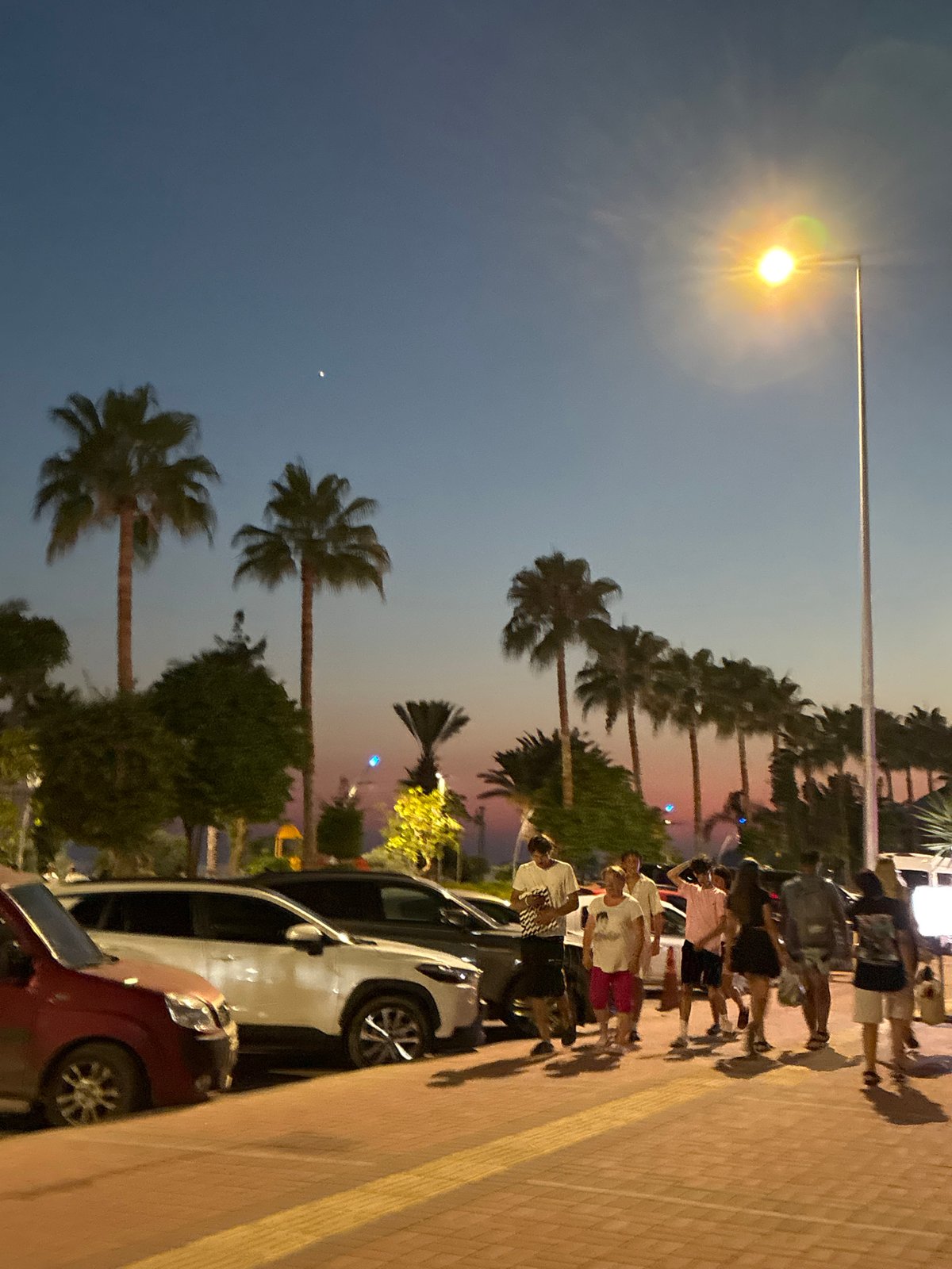 Street lamp glowing at dusk in Alanya, Turkey