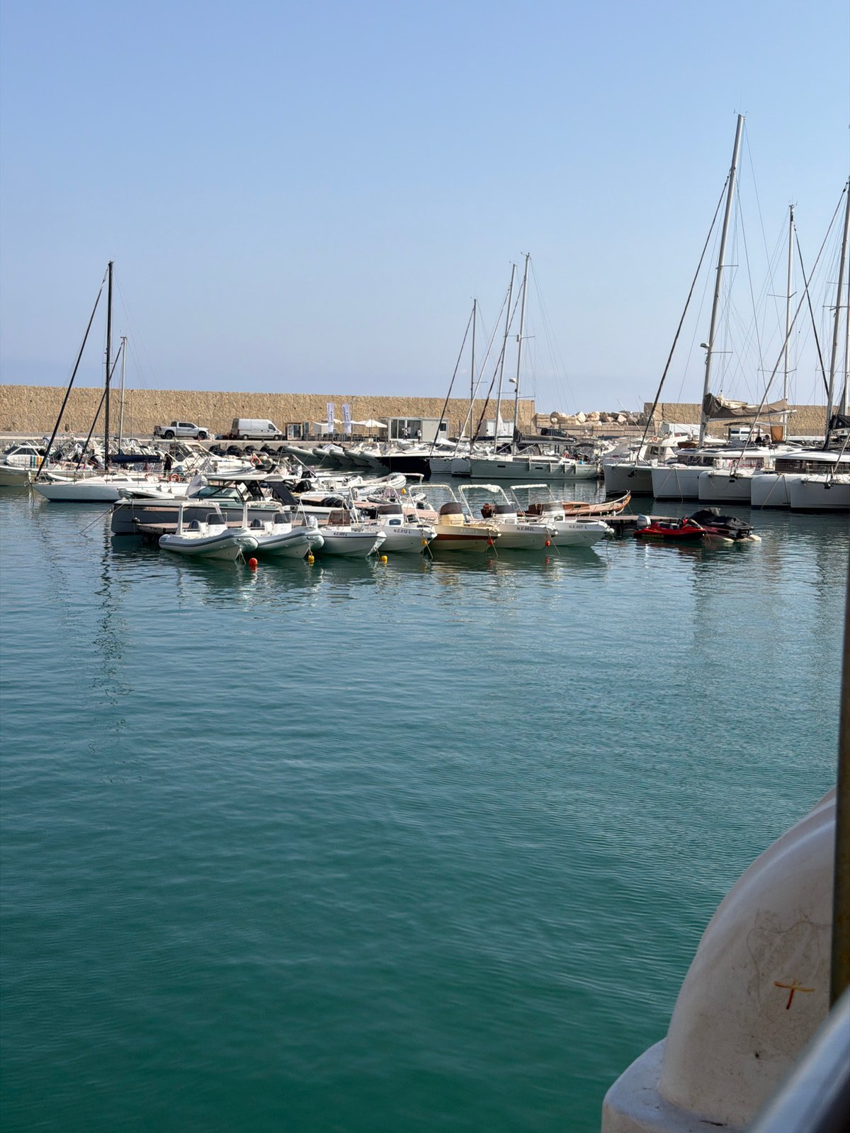 Leaving Castellammare del Golfo's marina by boat on a clear morning