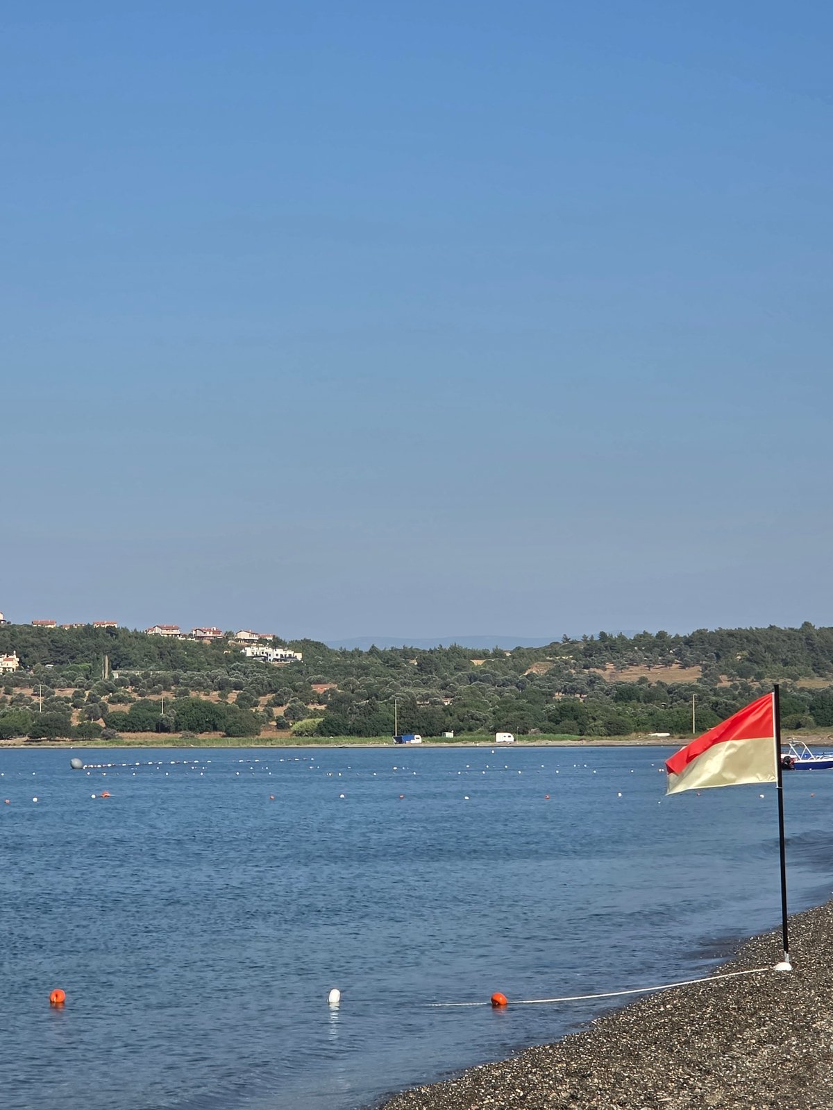 Quiet morning on Seferihisar's Aegean pebble beach
