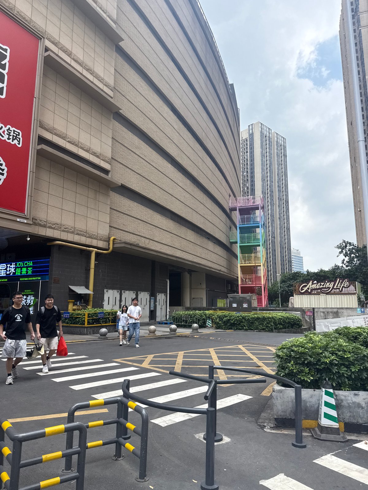 Haizhu District streets buzzing with delivery activity and parked scooters