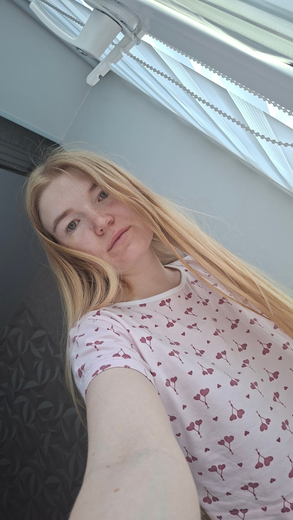 Cozy morning at home with a cat and cherry-print pajamas