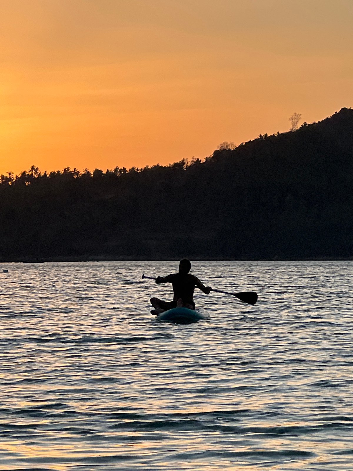 Paddleboard yoga and sunset silhouettes off Ko Pha-ngan