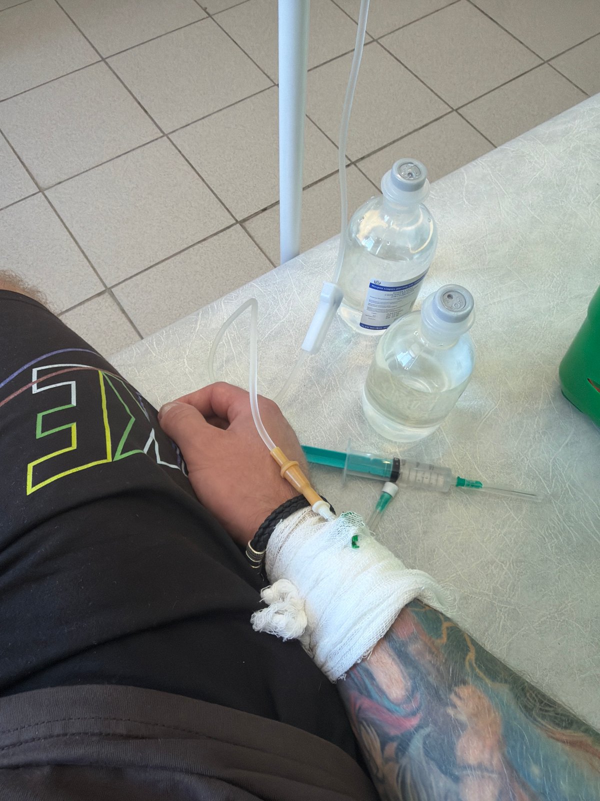 Patient receives IV treatment while enjoying latte in Chaikovsky