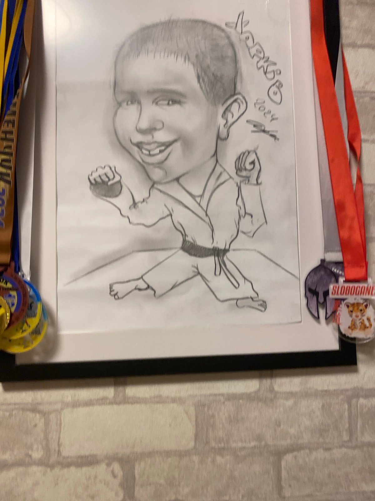Framed art, a carpet, and olive oil bottles inside a Kharkiv space