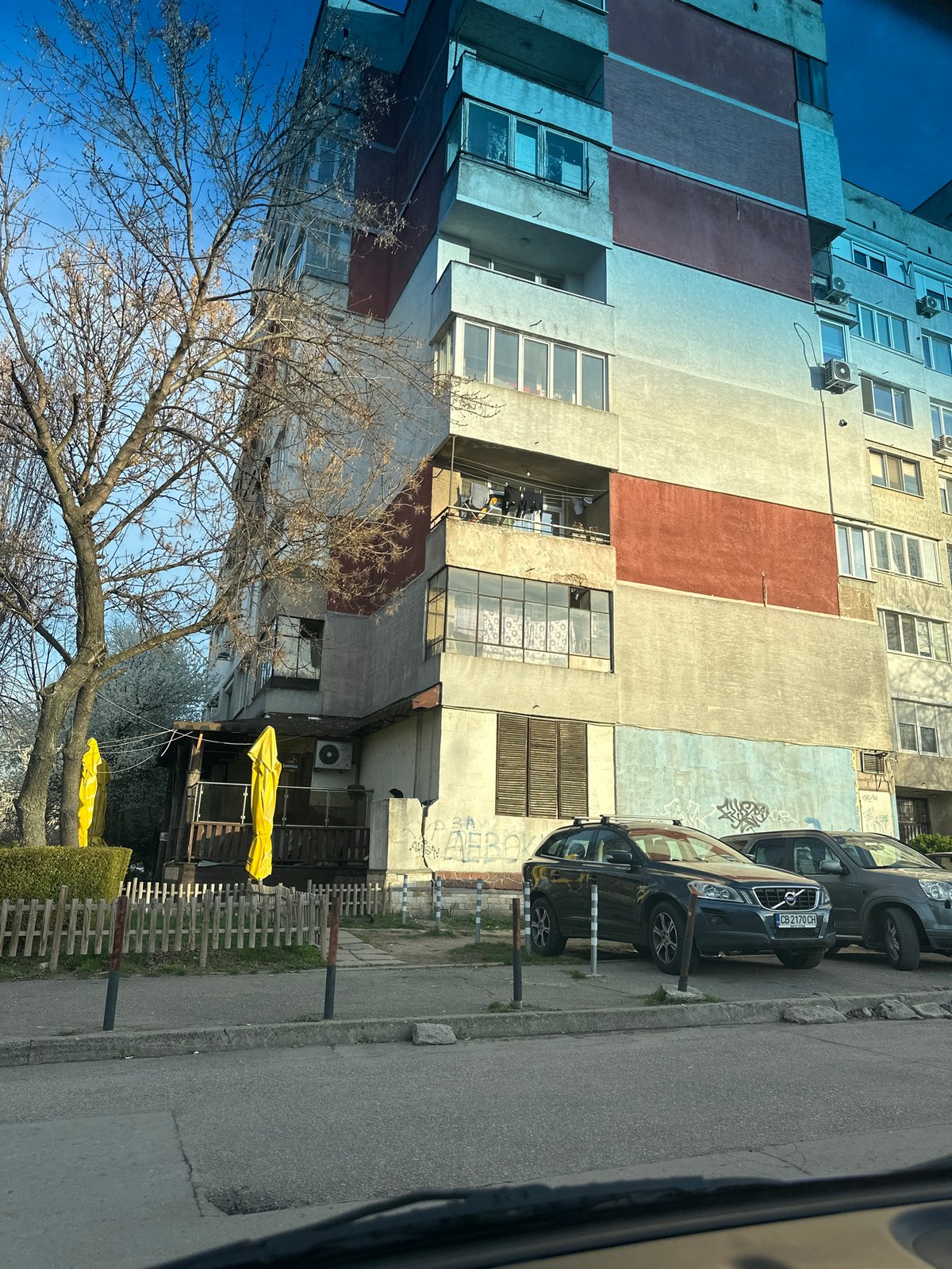 Everyday moments documented in Sofia: apartment building, mirror selfie
