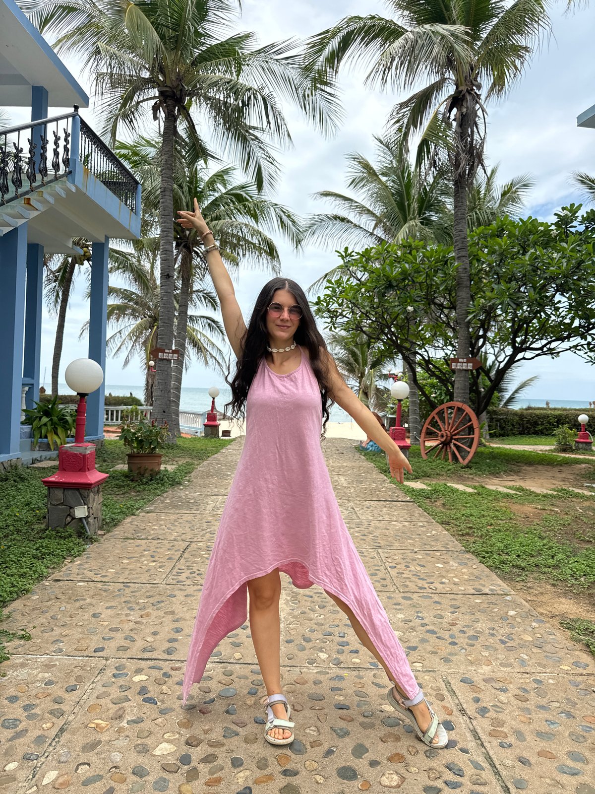 Woman poses for photos at tropical resort in Vietnam