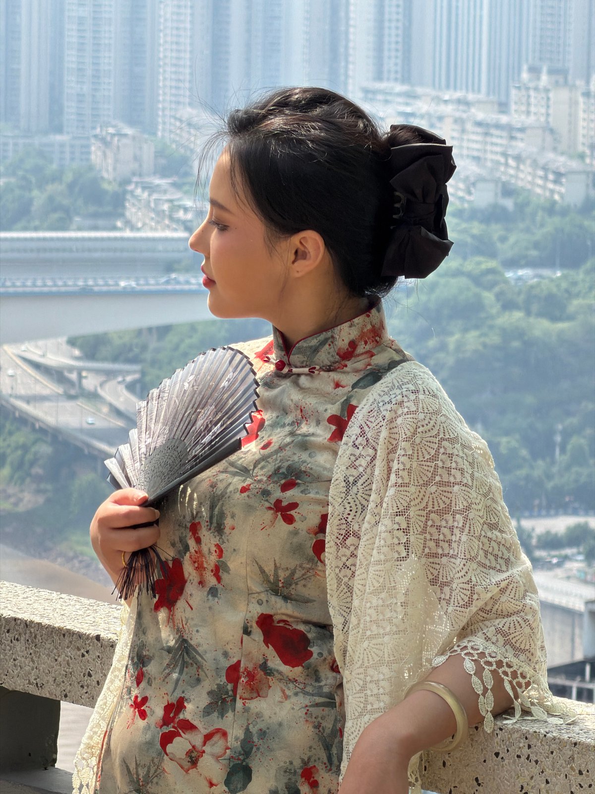 Woman in traditional qipao photographed in Yuzhong District