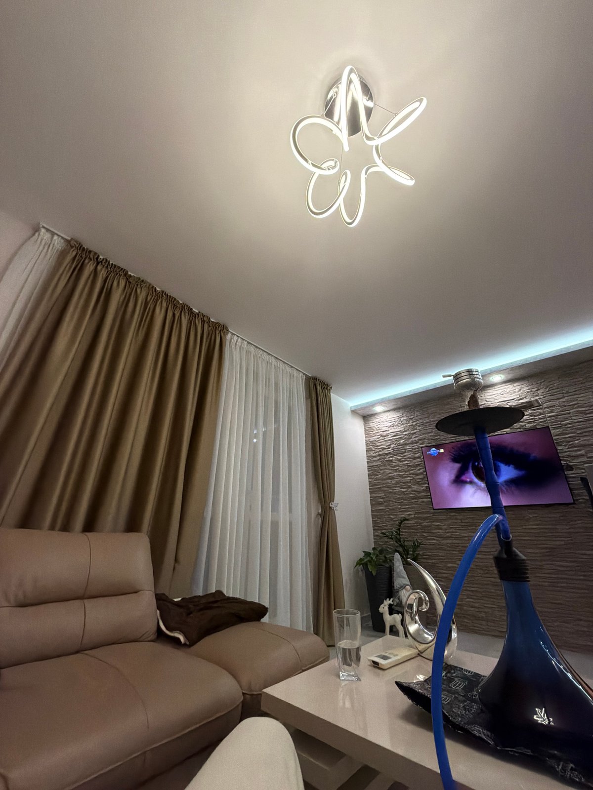 Young man relaxing in modern living room captured