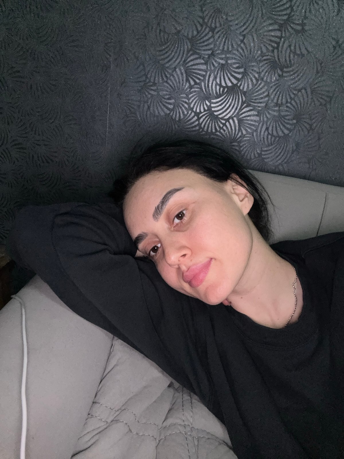 Woman photographed relaxing indoors in Tbilisi, Georgia