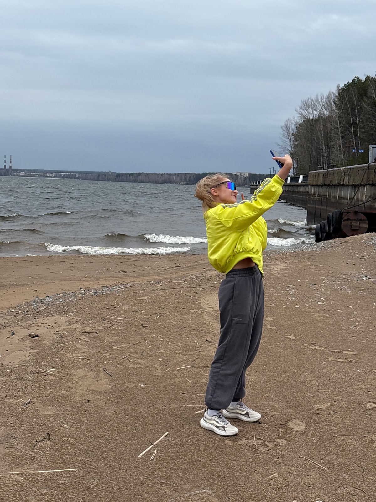 Woman enjoys morning riverside outing in Chaikovsky, Russia