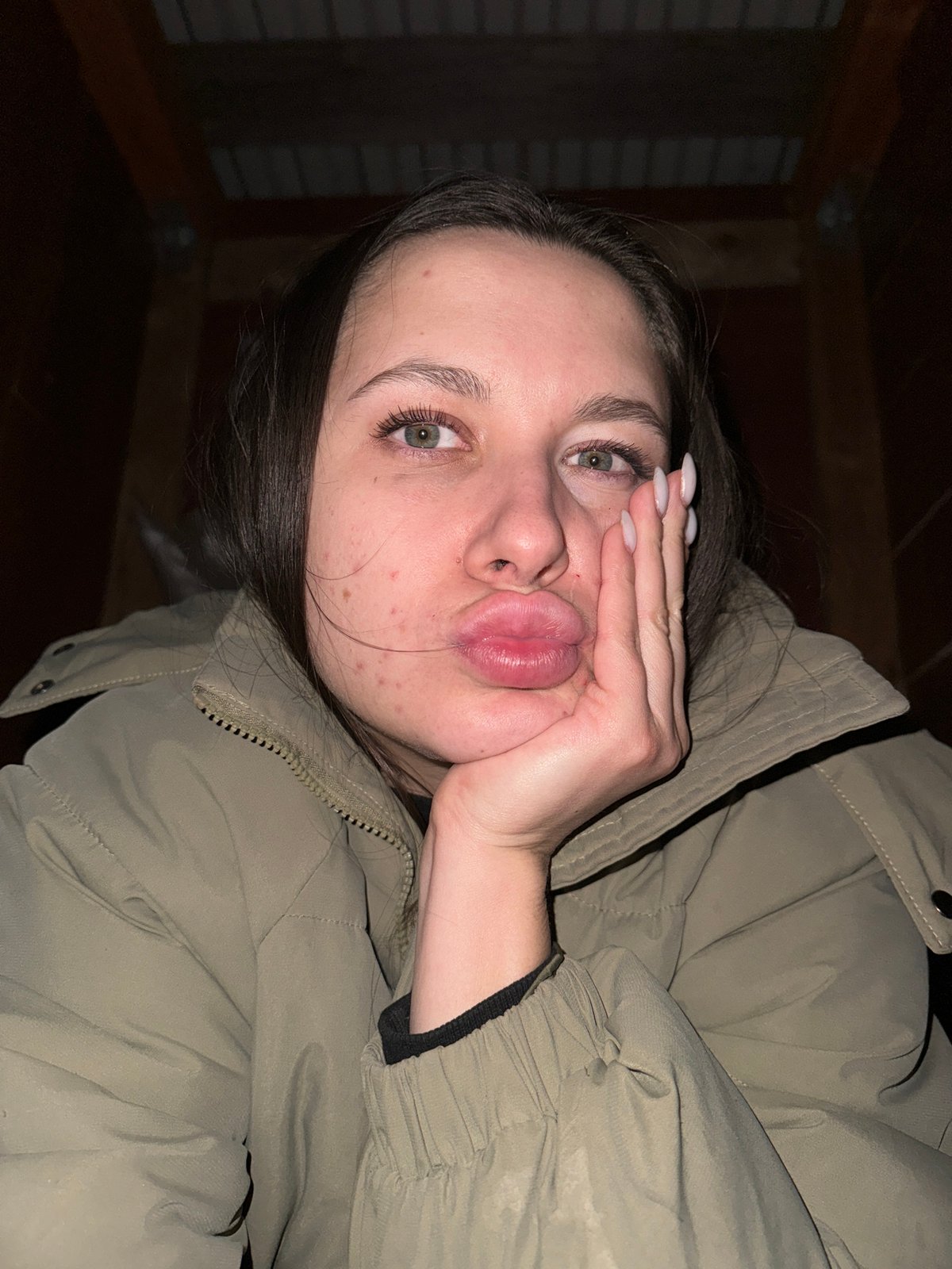 Portrait photo captures young woman's kissing pose