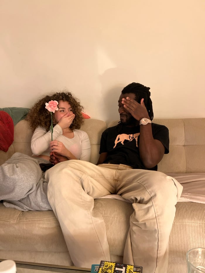 Couple enjoys quiet evening with takeout in Paris apartment
