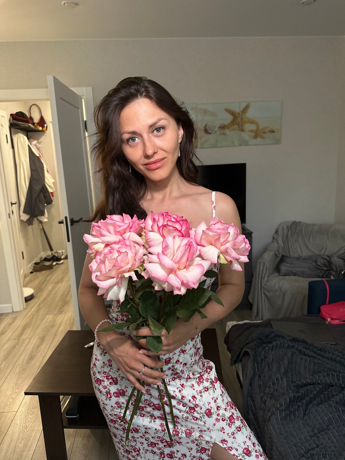 Pink roses and a floral dress in a Russian apartment