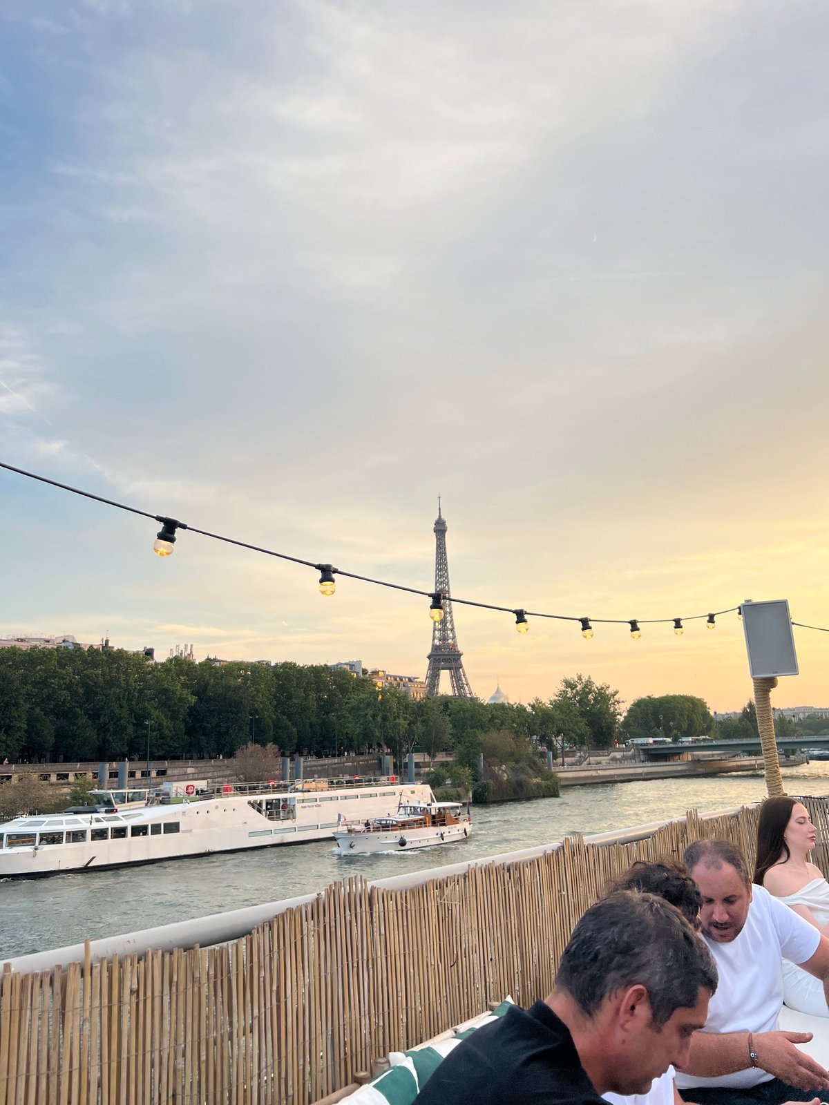 Eiffel Tower silhouette against a warm Paris dusk sky