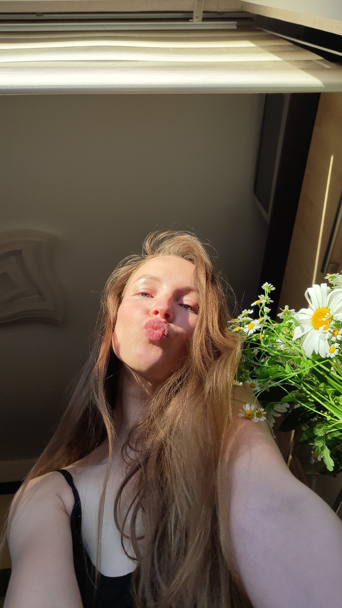 Woman photographs herself in multiple poses inside Chaikovsky residence