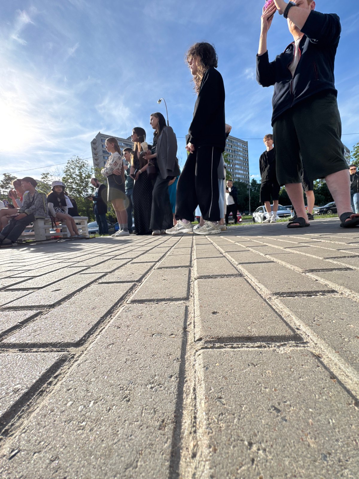 Young women perform outdoor concert under sunny skies