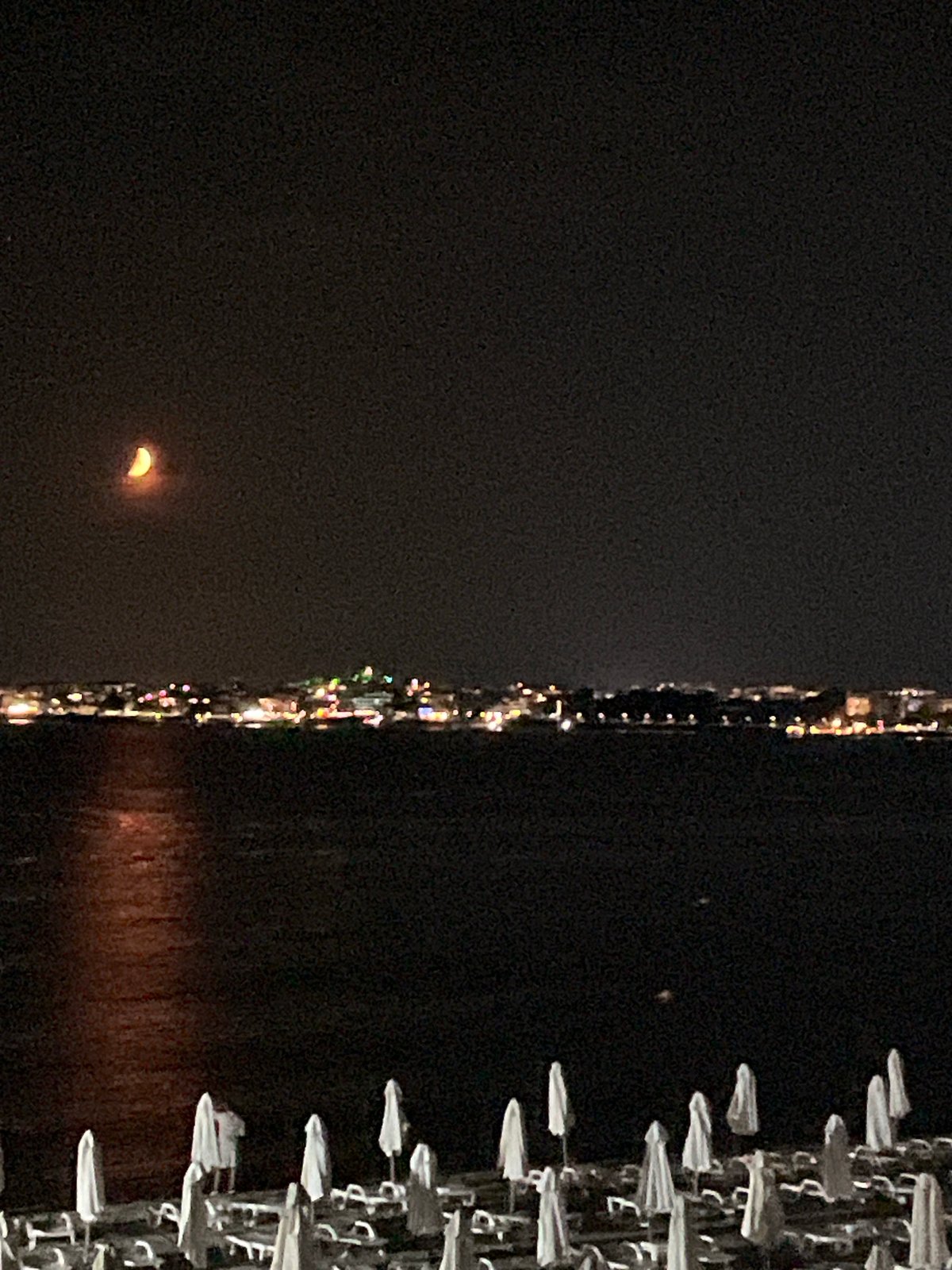 Crescent moon over a calm summer night in Nesebar