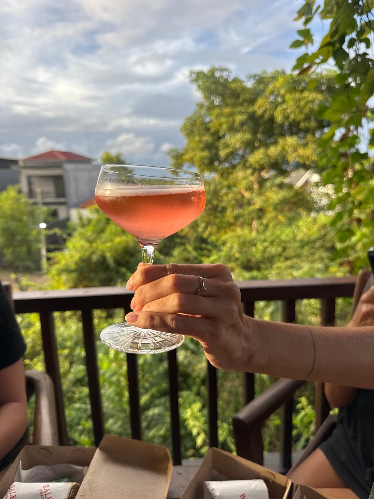 Casual patio lunch with pink cocktails documented in Kuta Selatan