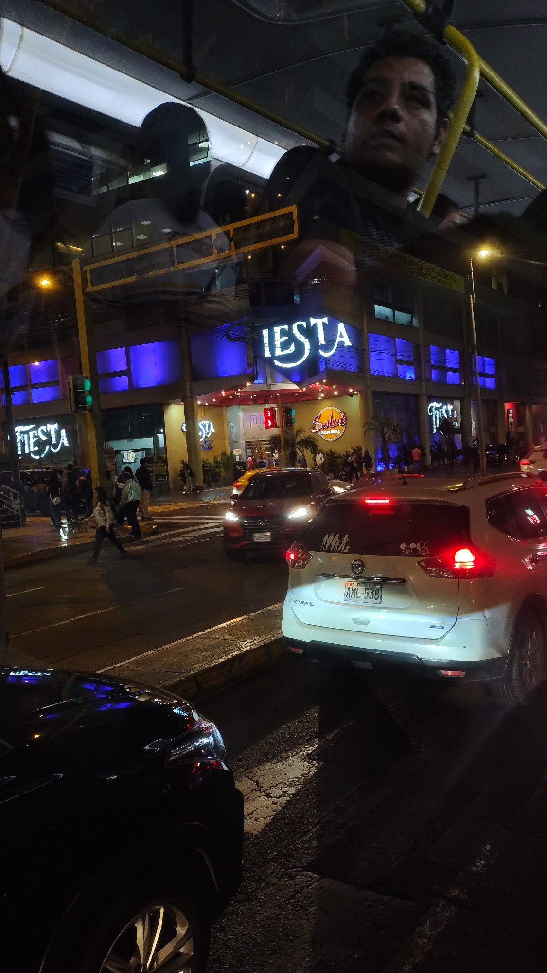 Nighttime vehicle reflection captured in Miraflores, Peru