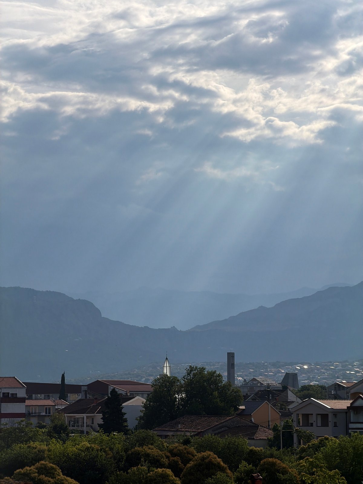 Podgorica morning: city rooftops meet hazy mountain backdrop