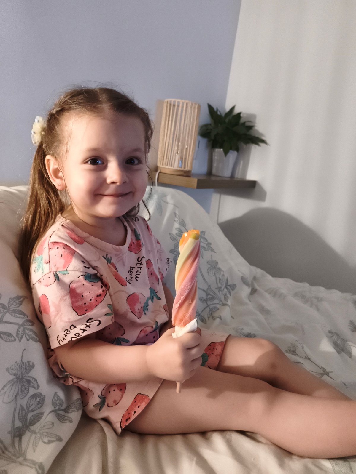 Summer evening snack on the bed, strawberry pajamas in France