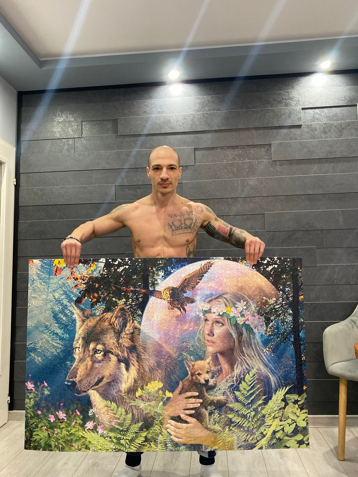 Man displays completed jigsaw puzzle in Pleven Bulgaria