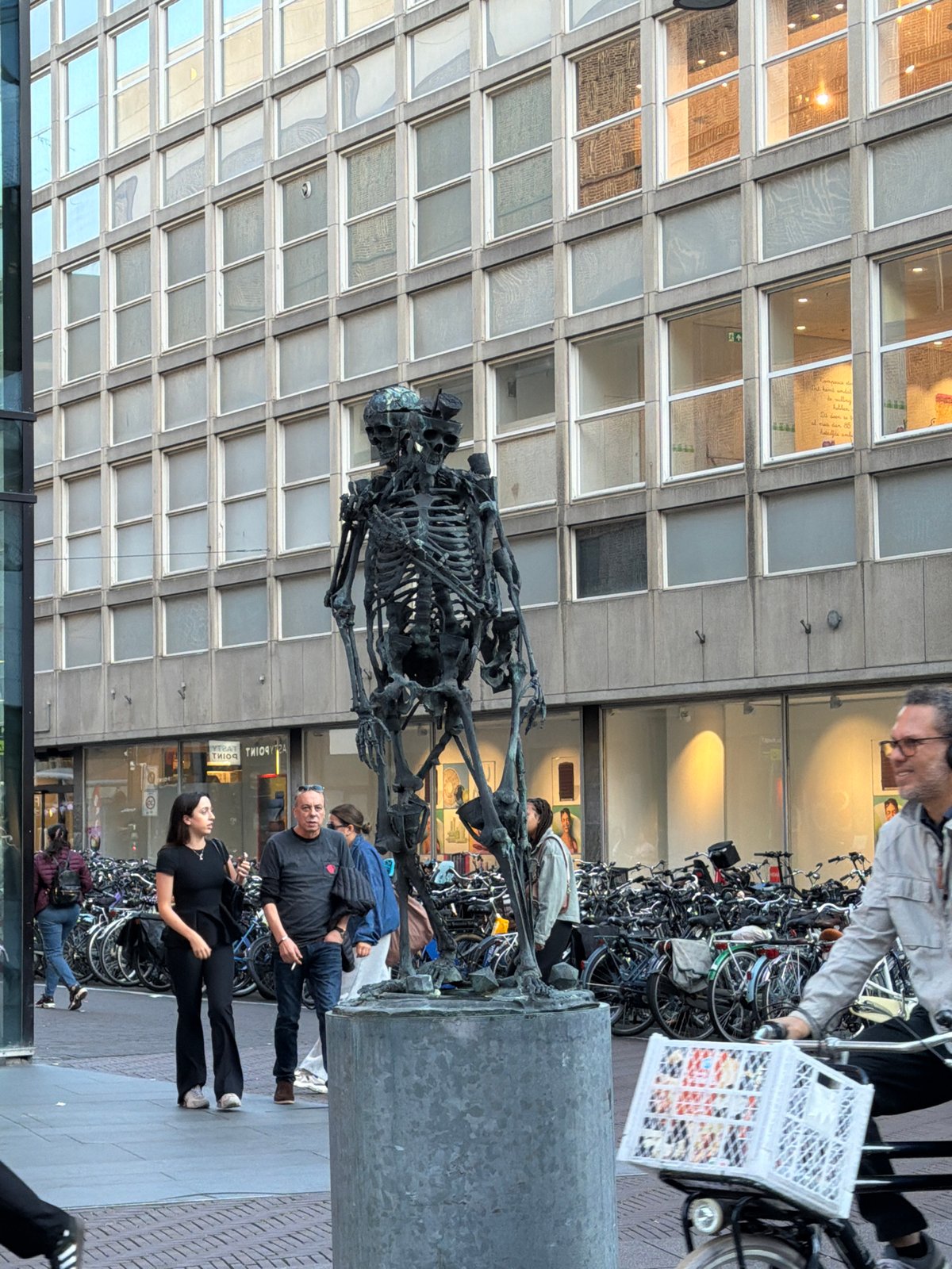 The Hague city center: sculptures, cyclists, and busy shopping streets
