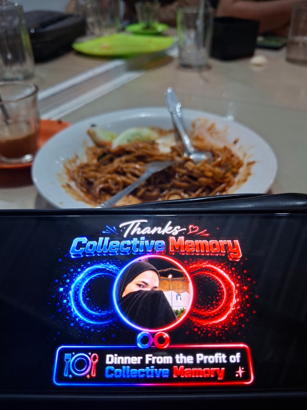 Men celebrate dinner funded by Collective Memory profits in Lhokseumawe