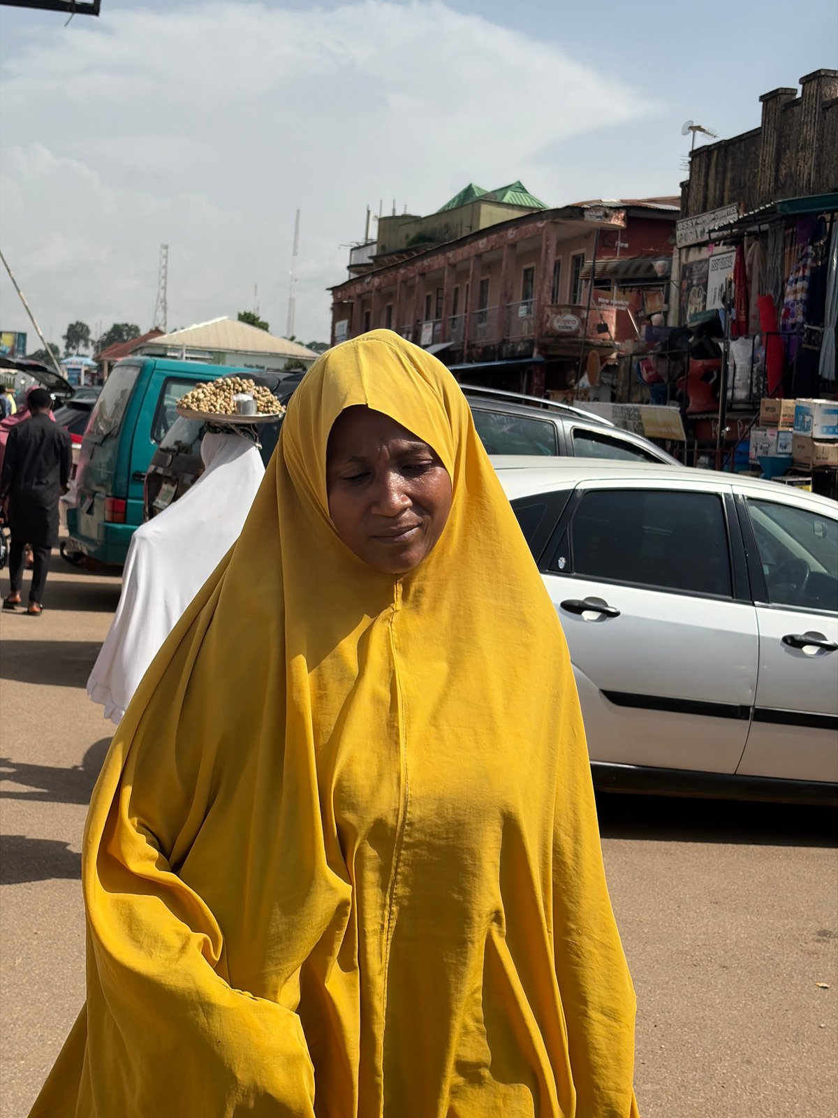 Midday street and market life across Jos, Nigeria