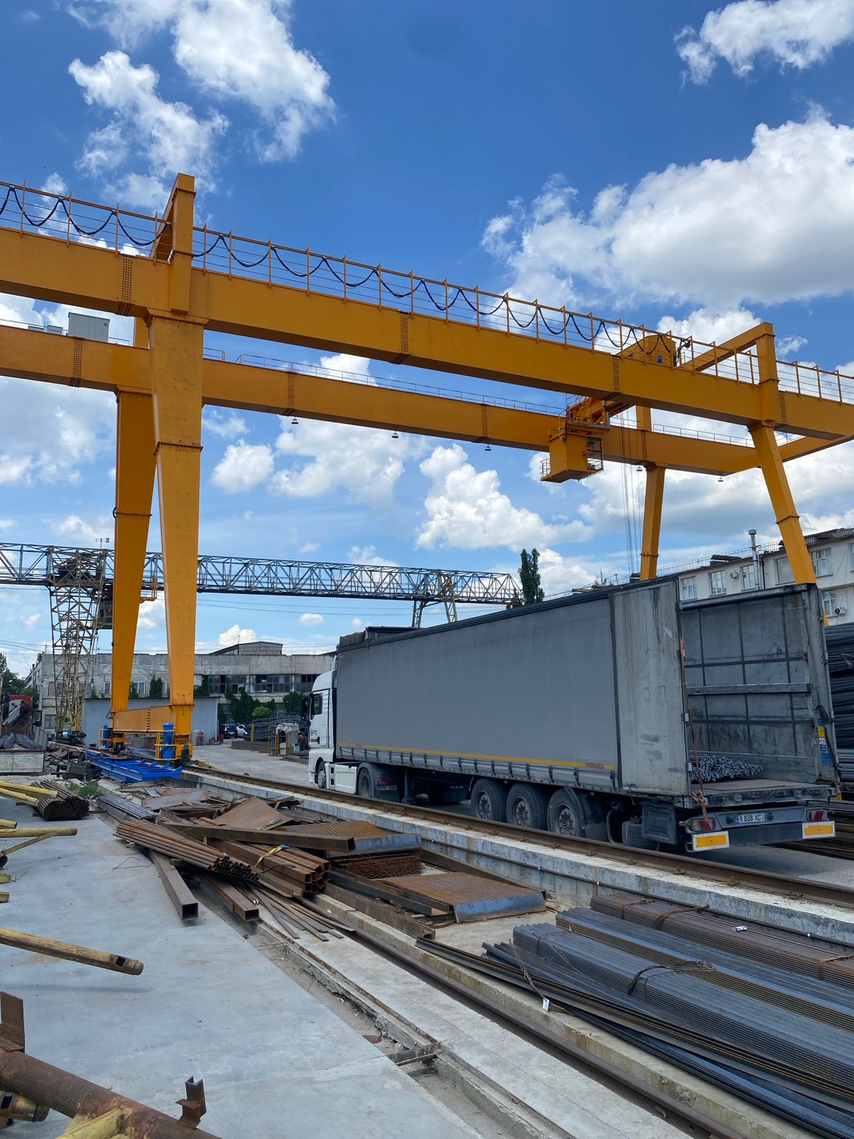 Yellow gantry cranes at a Chișinău industrial yard