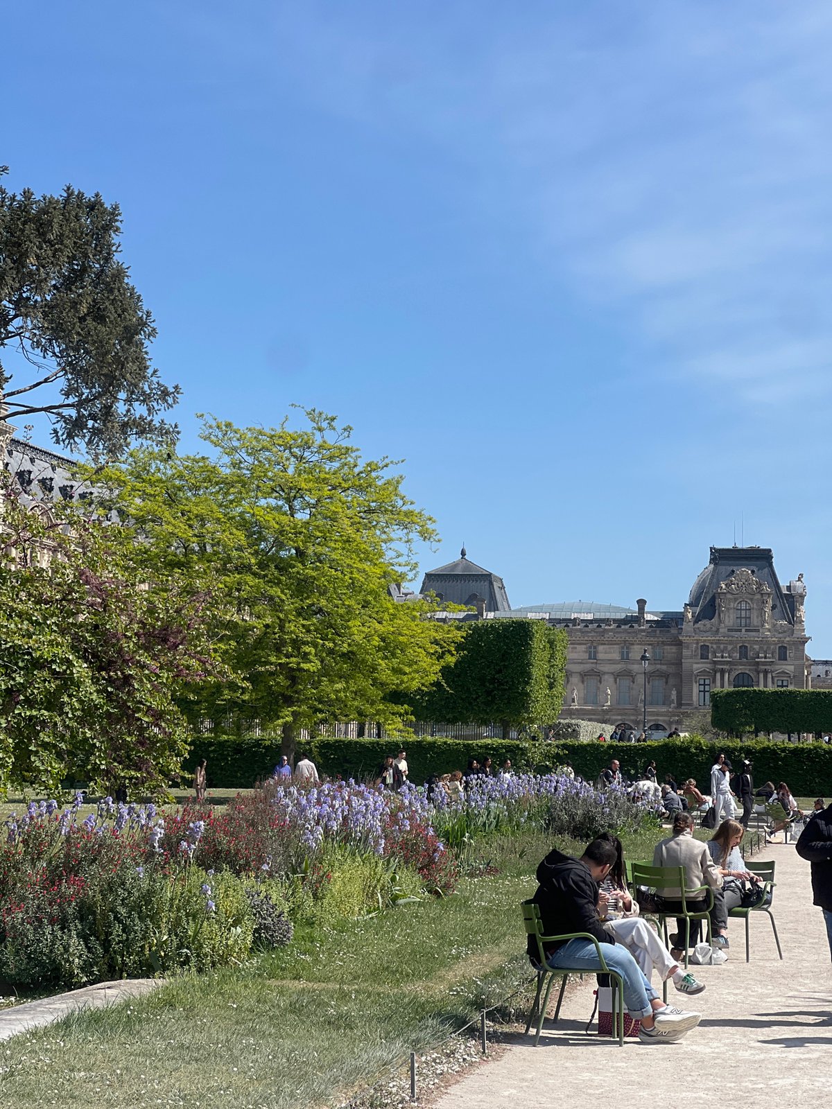 Sunny afternoon brings visitors to Paris's Tuileries Garden